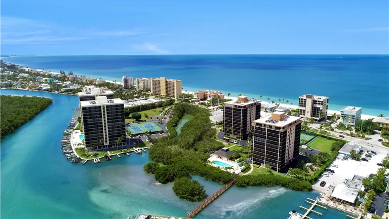 Seaside cityscape of Bonita Springs, Florida with ocean and marina.