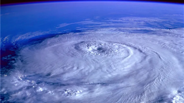 A breathtaking satellite image capturing a swirling hurricane over the Earth's ocean.